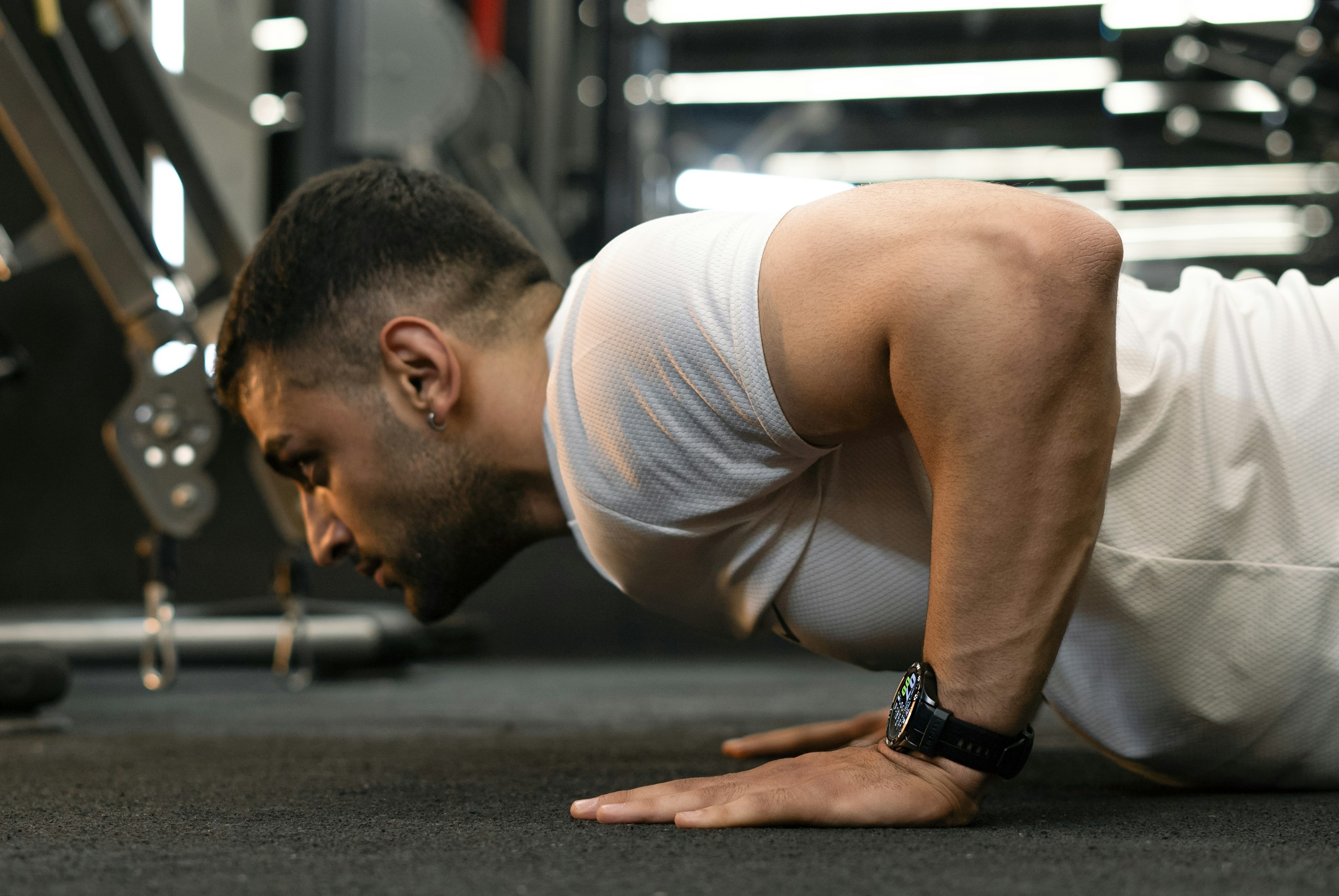 Man doing a push-up in a gym